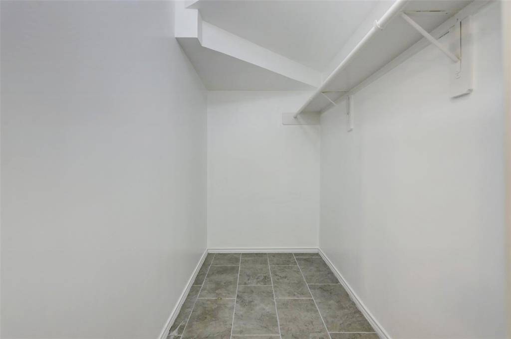 LARGE WALK-IN CLOSET IN DOWNSTAIRS BEDROOM