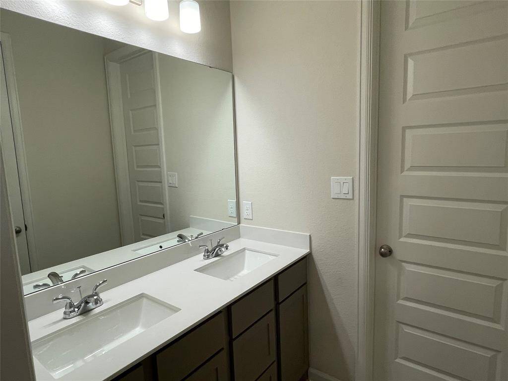 Double Vanity shared by two secondary bed rooms.