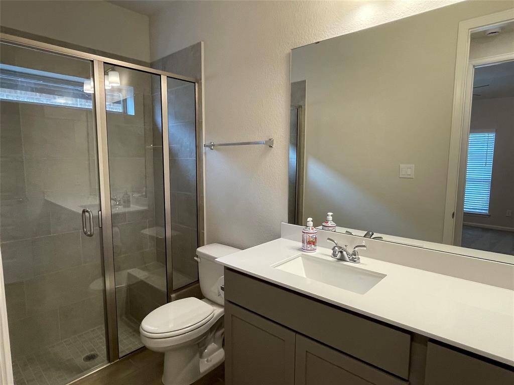 Guest Bedroom has walk in shower with sitting area in shower and its own Vanity.