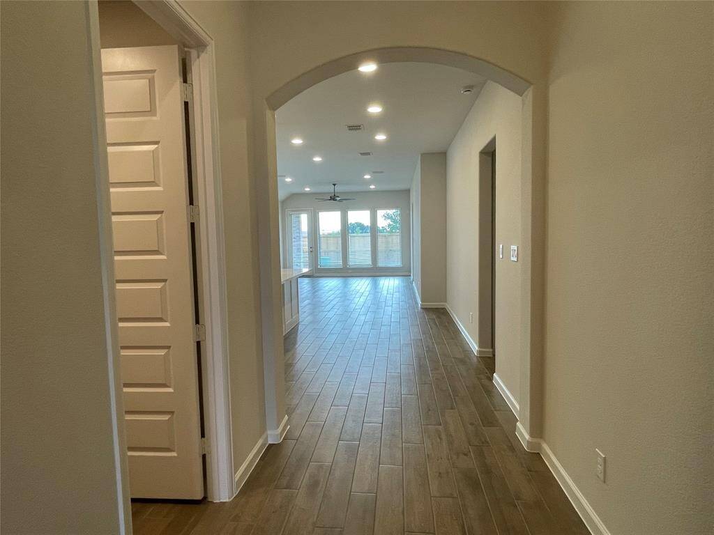 Hallway leading to Open Space Family Gathering area with 12 feet Ceilings.