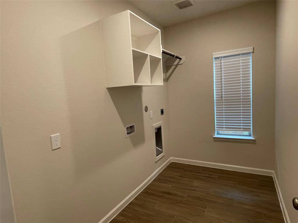 Laundry Room has enough space for additional refrigerator.
