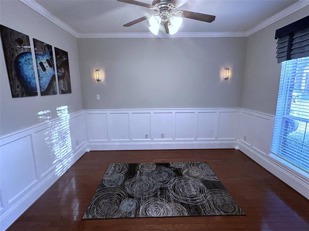 Study/den with wainscot and sconce lights