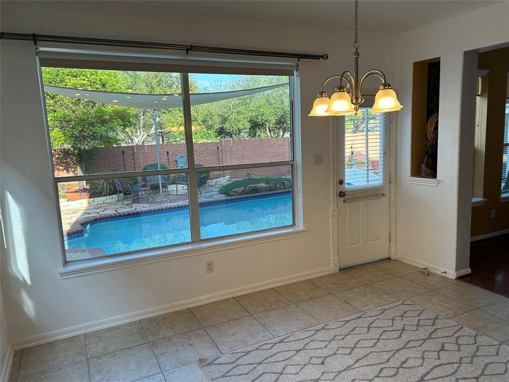 Large breakfast area with great view of and direct access to the pool area