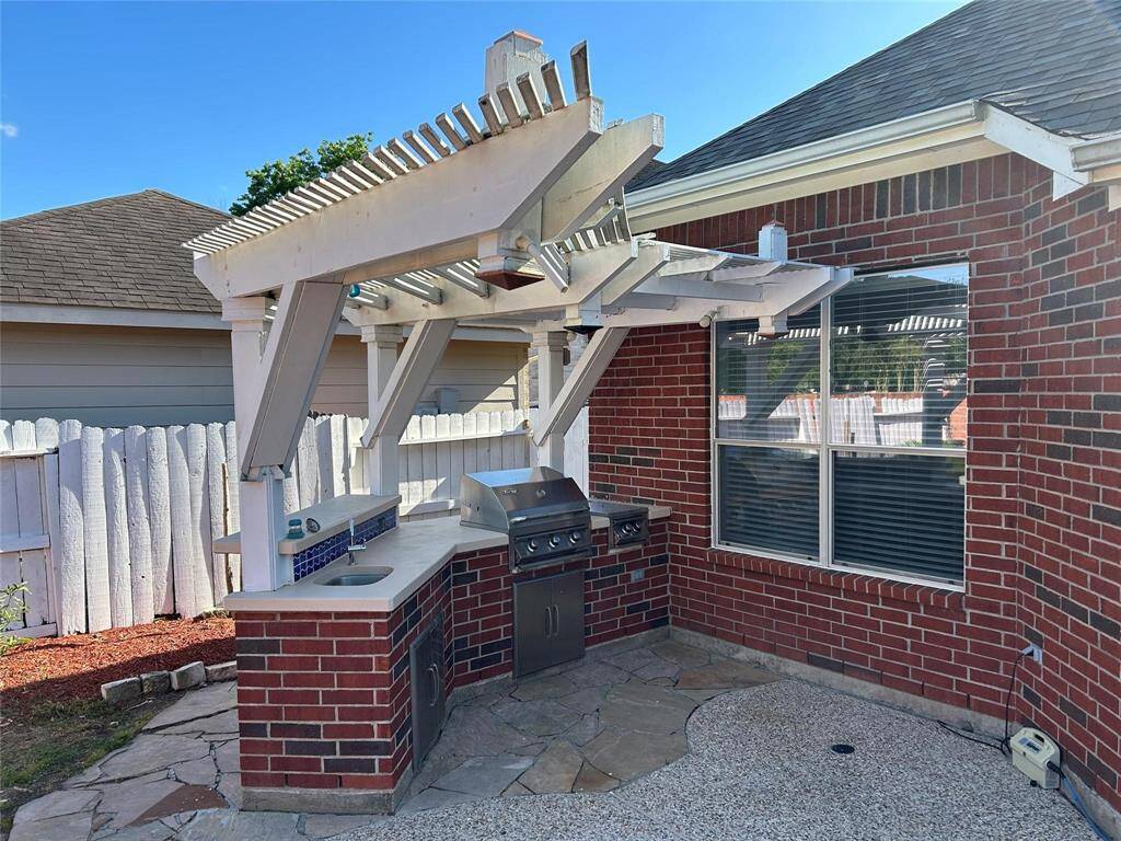 Full-fledged outdoor kitchen with...