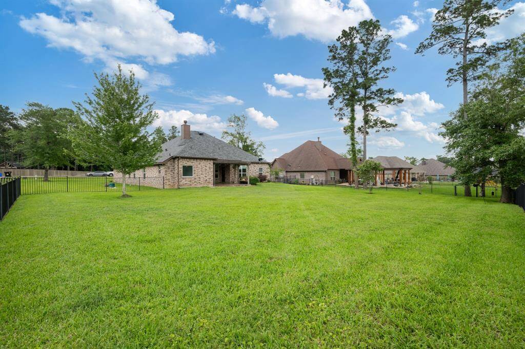 Wide-angle perspective showcasing the generous lot size and manicured lawn—perfect for gatherings, pets, or gardening.