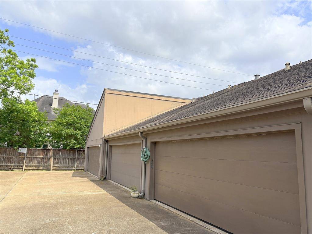 Back view of the home, garage and driveway