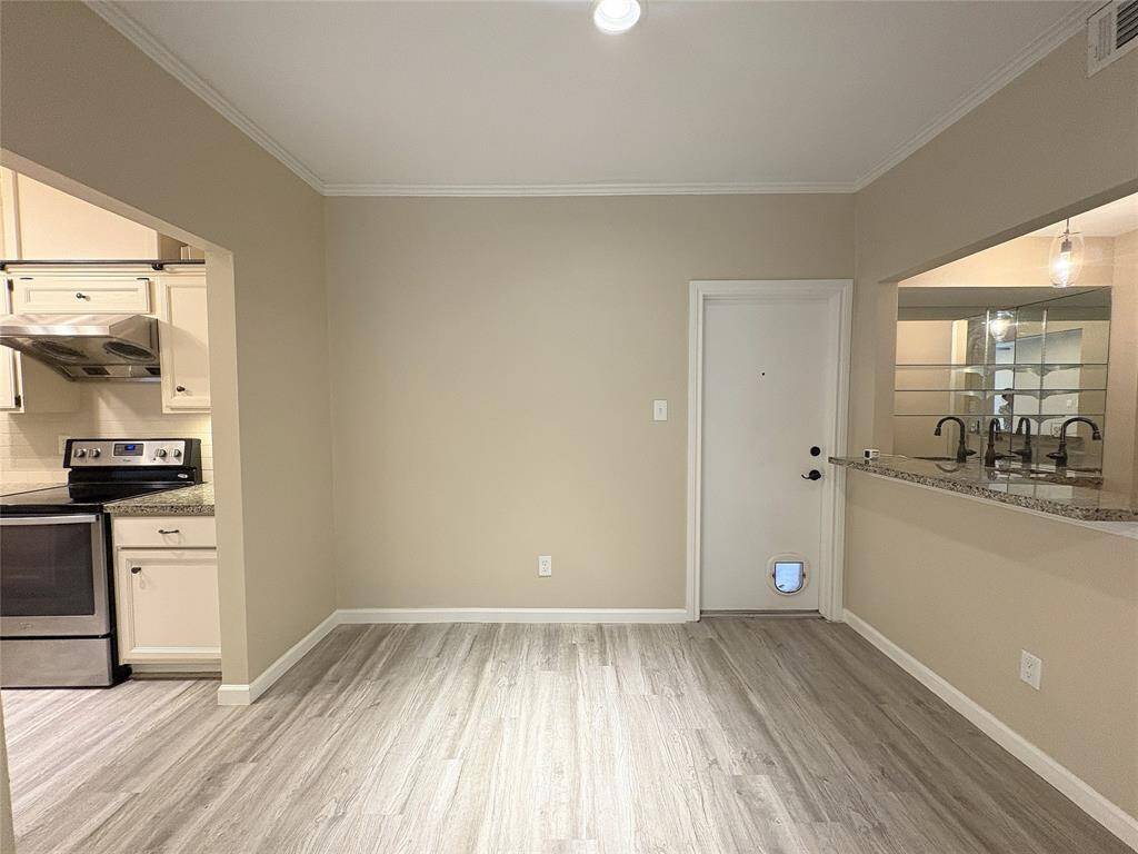 Another view of the dining room , kitchen is conveniently located on the right  and wet bar on the left.