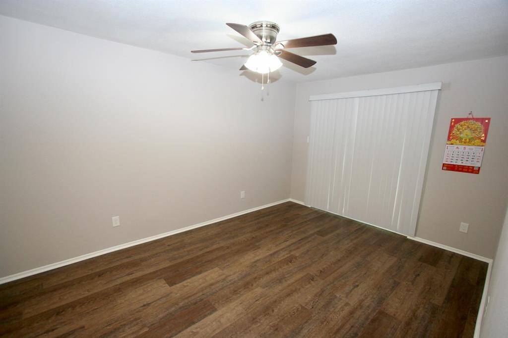 Master Bedroom with sliding glass door into the patio area. New ceiling fan.