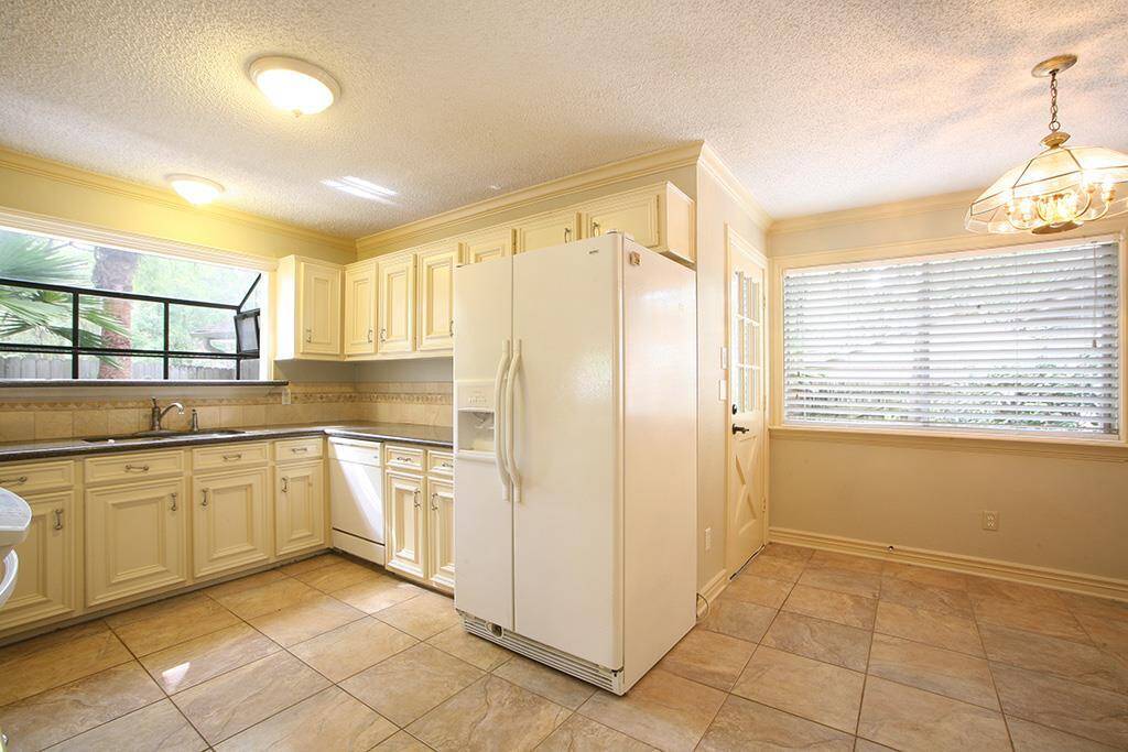 Functional, light, bright with raised panel cabinet doors, herb garden and pass through to kitchen, private, but not isolated for the cook!