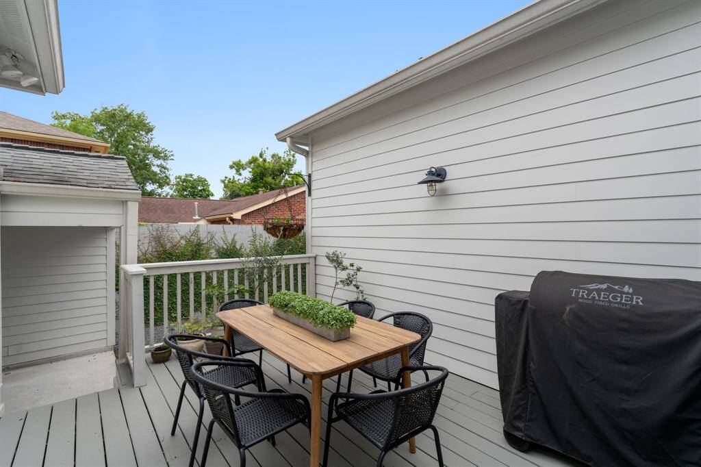 Enjoy al fresco dining and weekend grilling on this peaceful back deck, complete with a BBQ grill and seating for six.