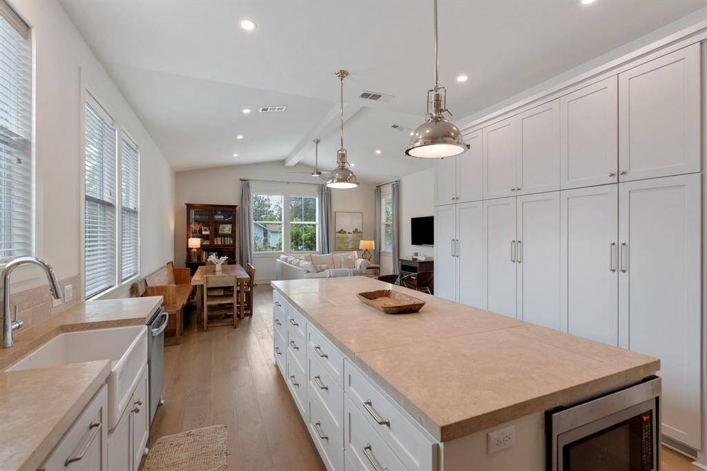 From the kitchen sink, enjoy sightlines that stretch across the dining area and into the living room. The layout is both beautiful and efficient, perfect for everyday routines or entertaining.
