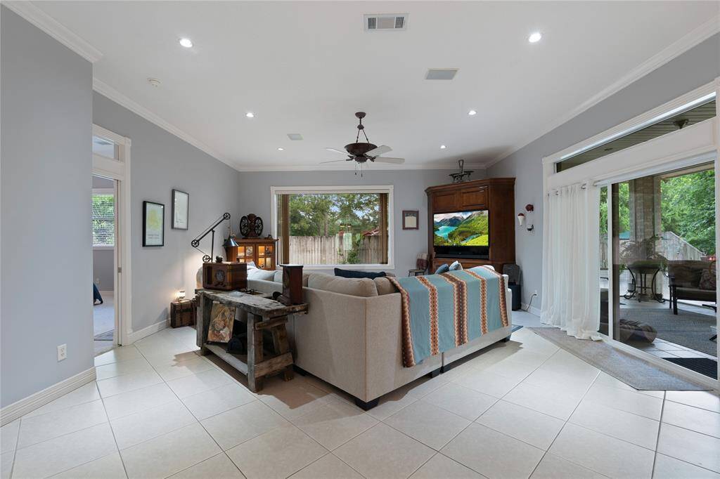 Living Area with Views of the backyard, Screened in Porch and Pool, Notice the large Picture Window that provides these wonderful views