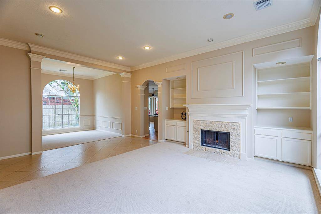 Cozy fireplace in large formal living room.