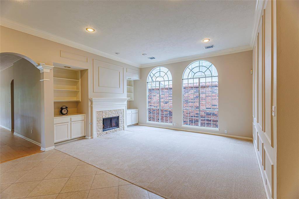 Atrium allows lots of light in formal living room.