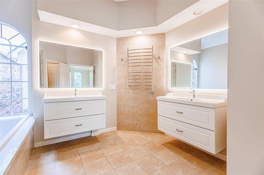 Updated master bath with towel warmer.