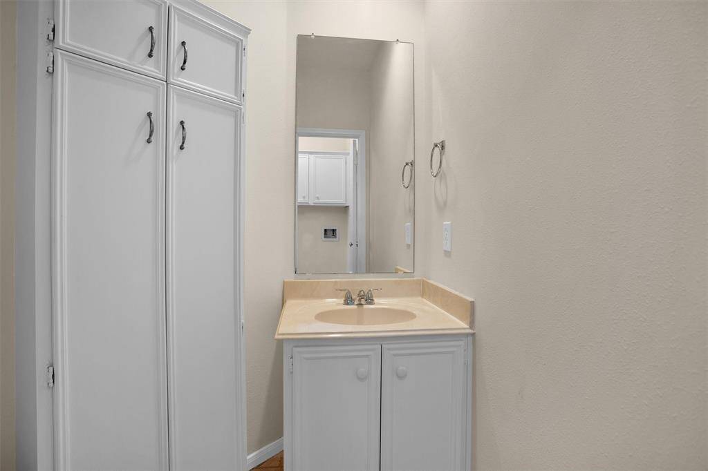 Guest half bathroom off the utility room
