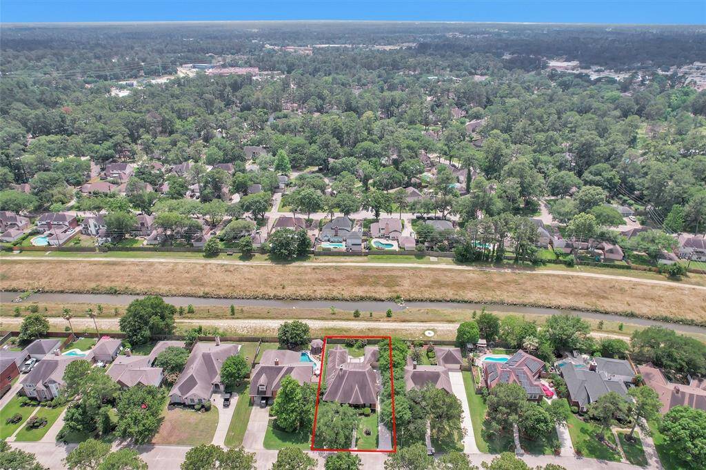 Aerial view showing walking path behind the home