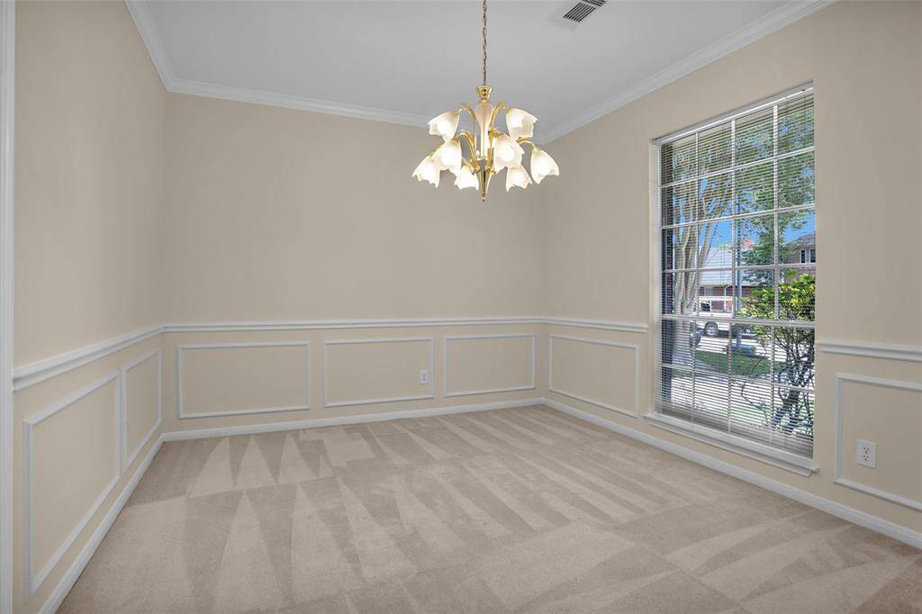 Elegant formal dining room with chair rails