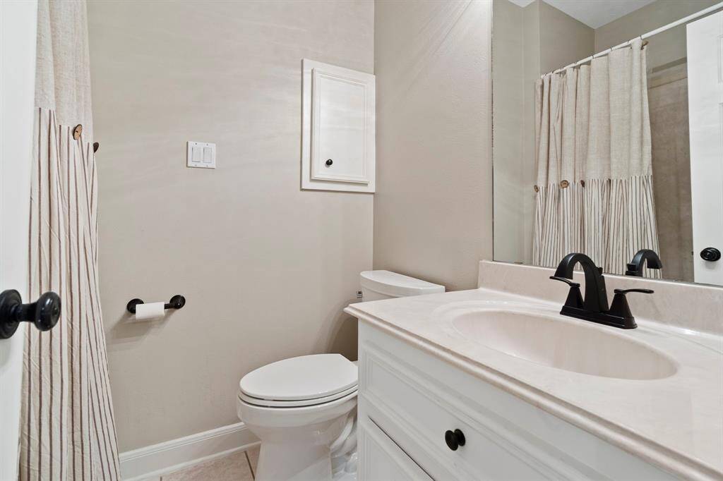 This private ensuite bath offers both comfort and functionality with a convenient shower/tub combination—perfect for quick mornings or relaxing soaks.