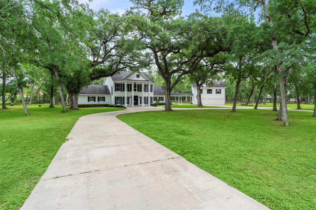 This home is ideal for those seeking a blend of traditional charm and ample outdoor space.
