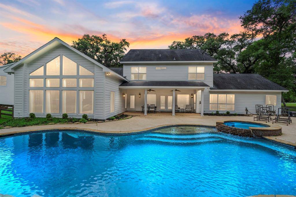 Surrounded by lush greenery and peaceful landscaping, this twilight scene captures the perfect blend of tranquility and elegance—an ideal setting for evening gatherings or quiet relaxation.
