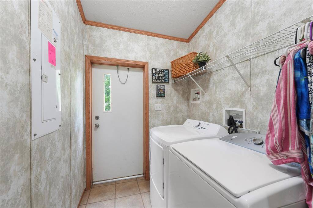 Laundry room with one of the two exits to the back yard.