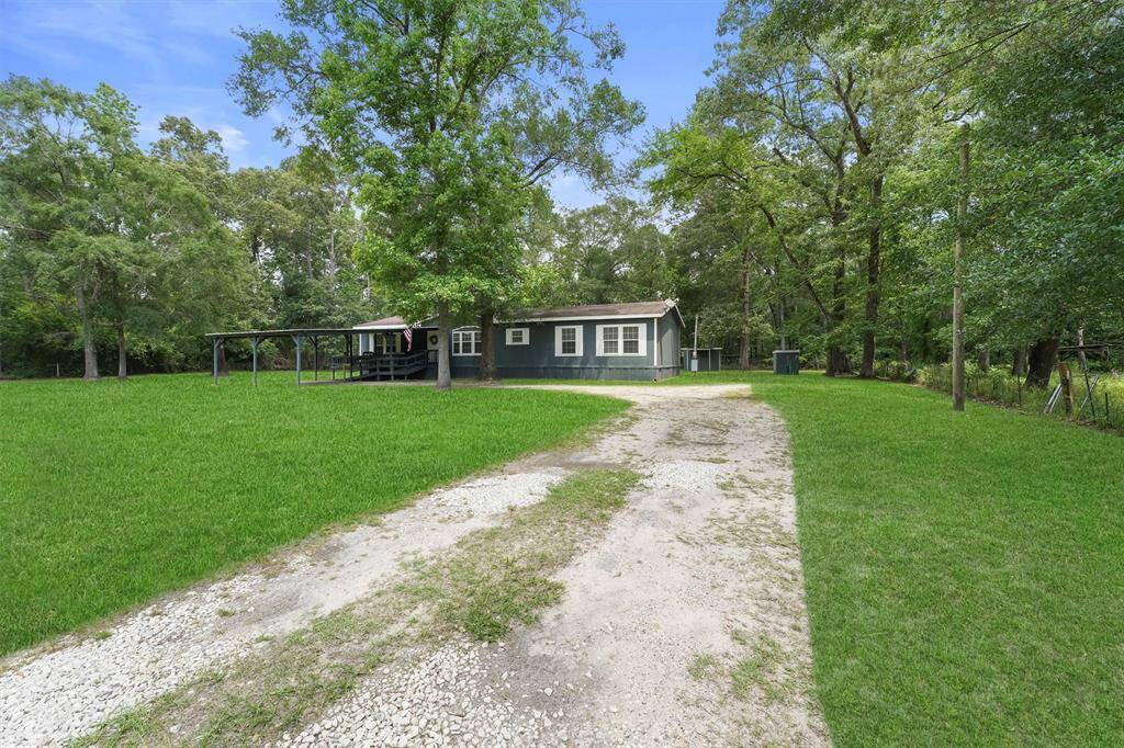 Home is set back from the road with plenty of room in the back yard