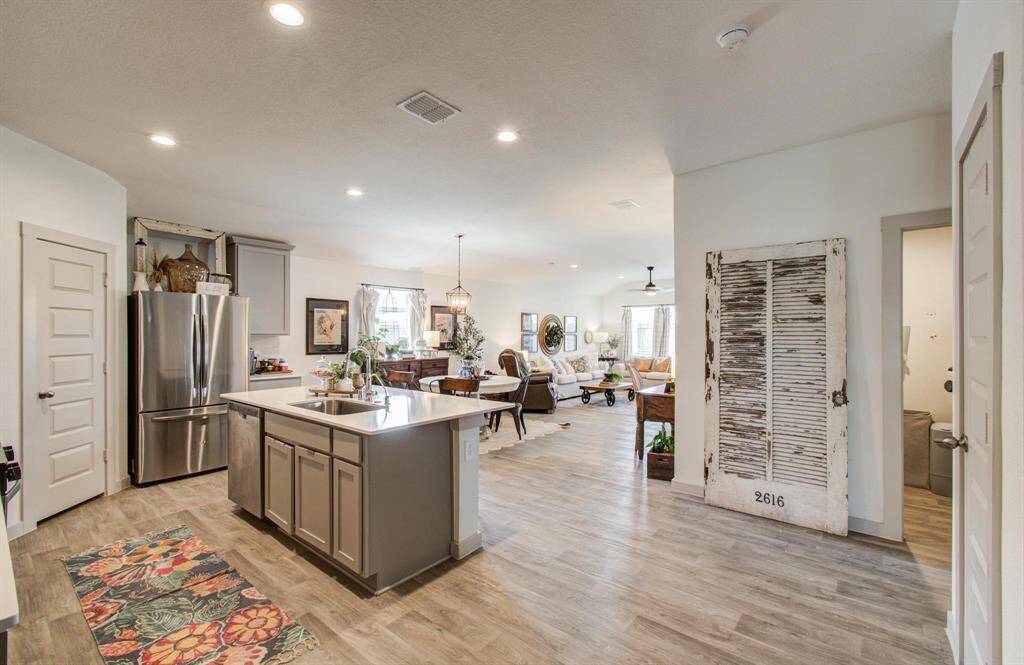 Kitchen open to the living room with laundry room to the right!