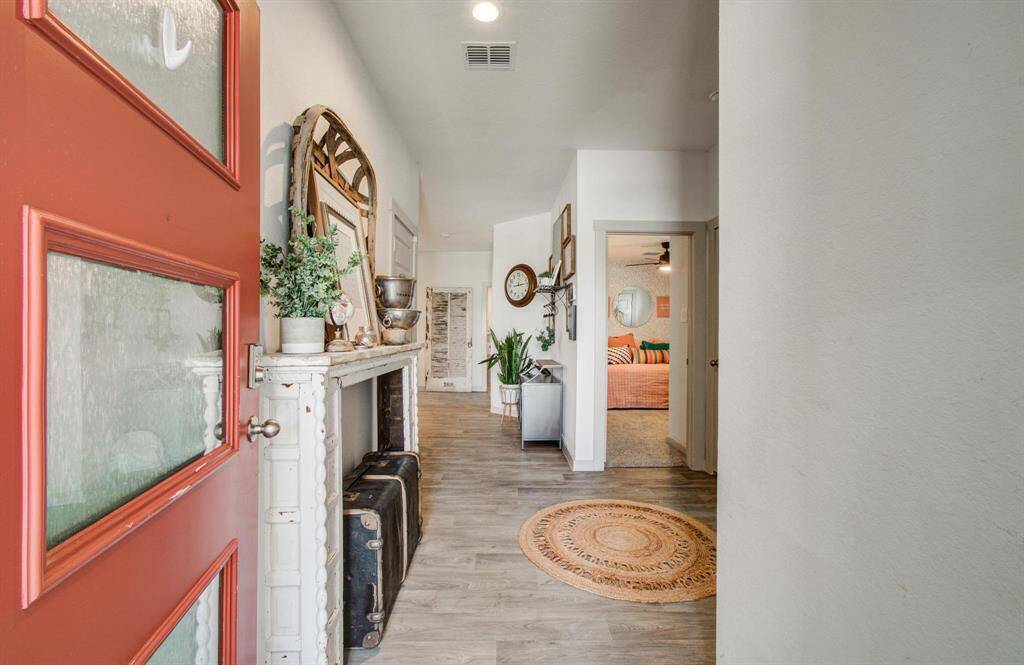 Looking toward the entry way with office and secondary bathroom to the left