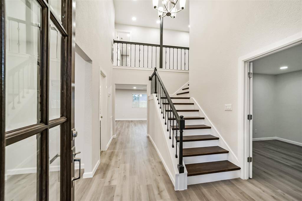 Hard wood staircase and rod iron spindles