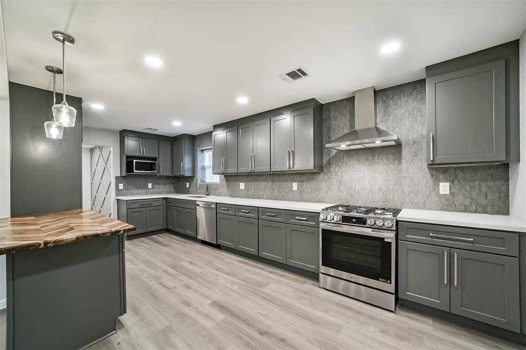 Herringbone butcher block countertop on breakfast island