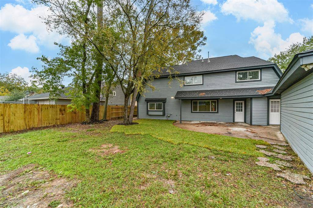 Large backyard with mature trees