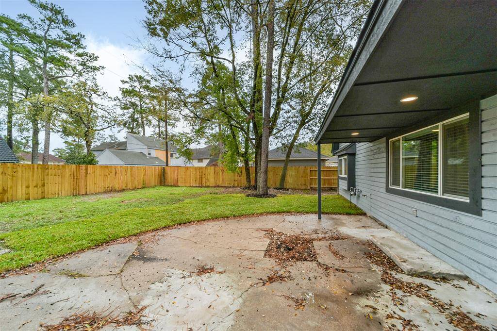 Large partially covered patio with exterior lighting