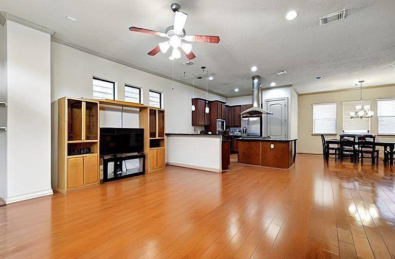 Open Living Room concept with modern hardwood floors and recessed lighting to provide comfort