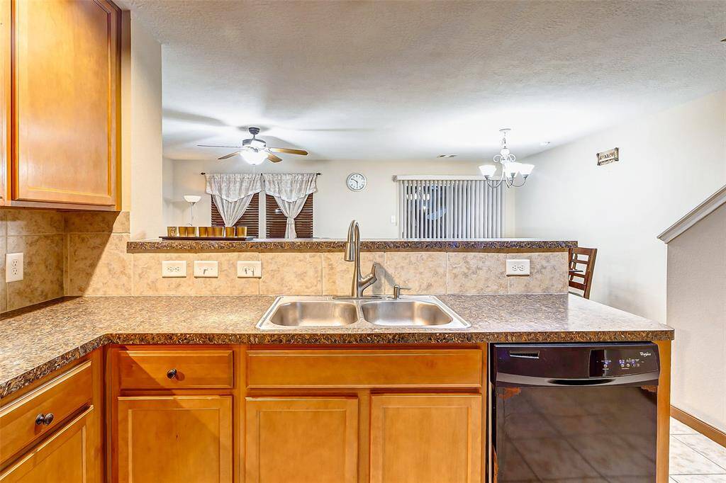 Kitchen Oversees Living Room Area.