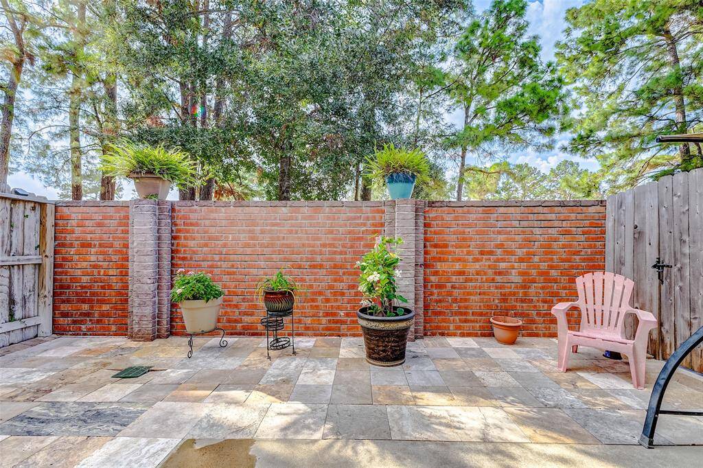 Enjoy this private backyard area provided with plenty of shade by the surrounding trees.