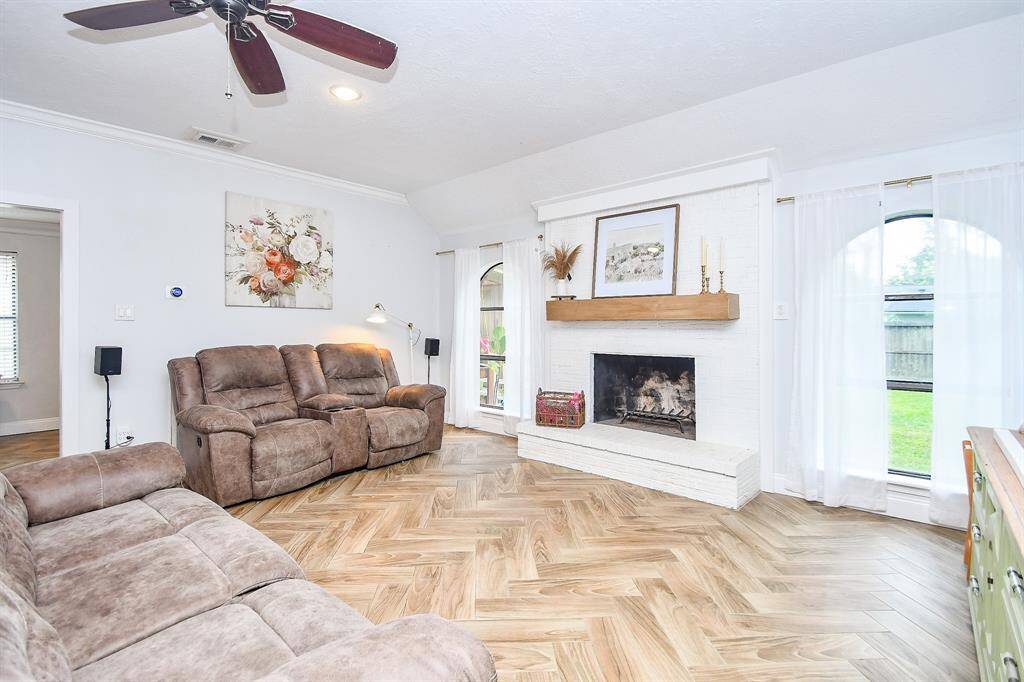 Light and Bright with a ceiling fan and windows that let in a lot of natural light!