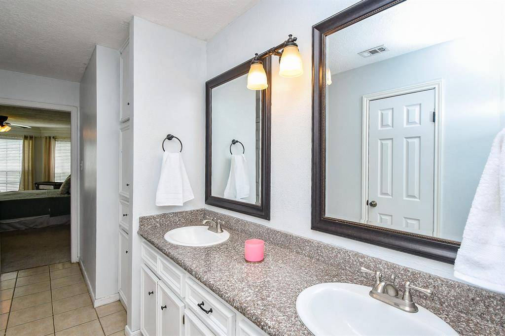 This large vanity sits across from 2 walk-in closets in the Primary Bathroom.