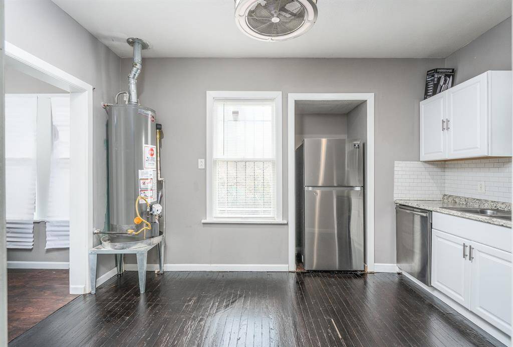 Kitchen with pantry, ,utility room, and access to backyard to the left