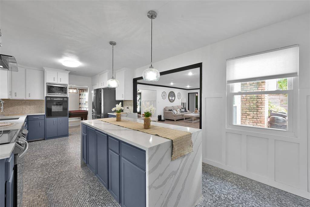 Updated and reconfigured kitchen with the addition of this beautiful waterfall island!
