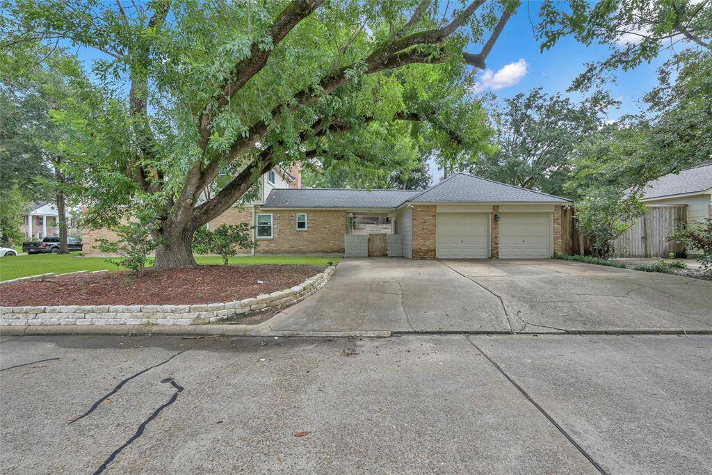 Three-car driveway located on the side of the house with access to the garage and backyard!