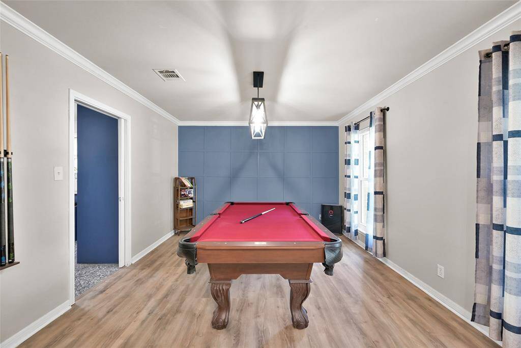 Formal dining room connected to the kitchen. The pool table can convey!