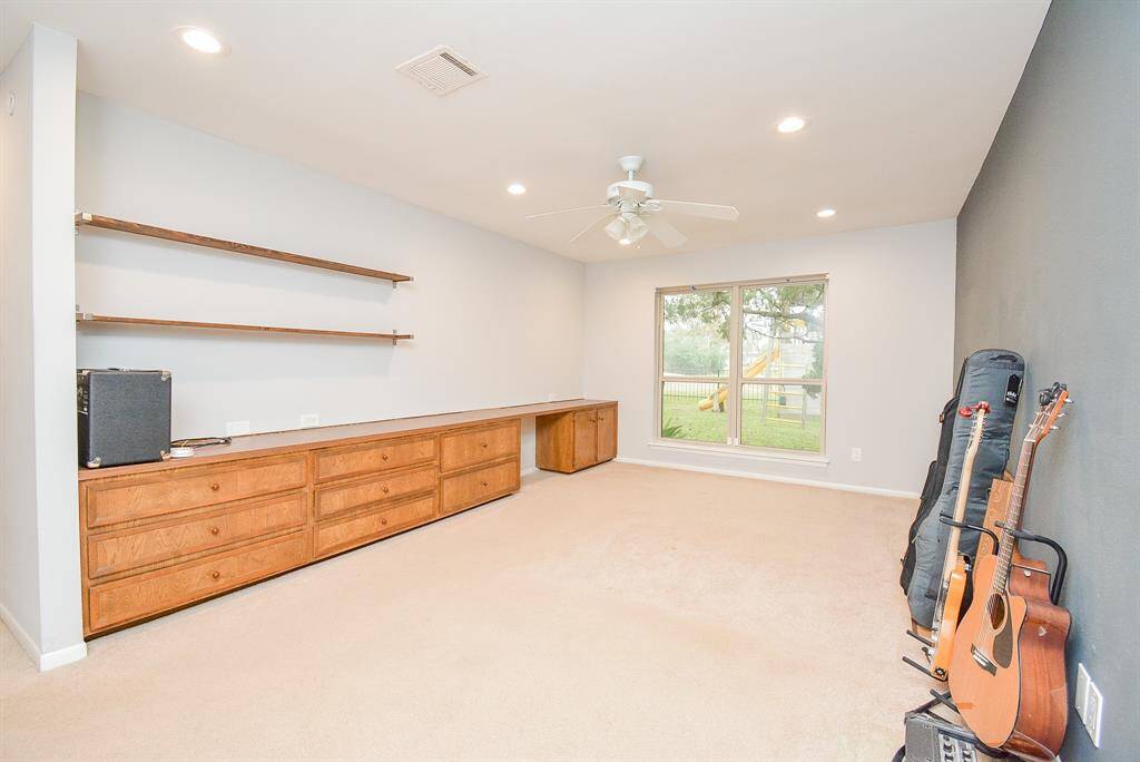 PRIMARY BEDROOM OVERLOOKING THE GOLF COURSE
