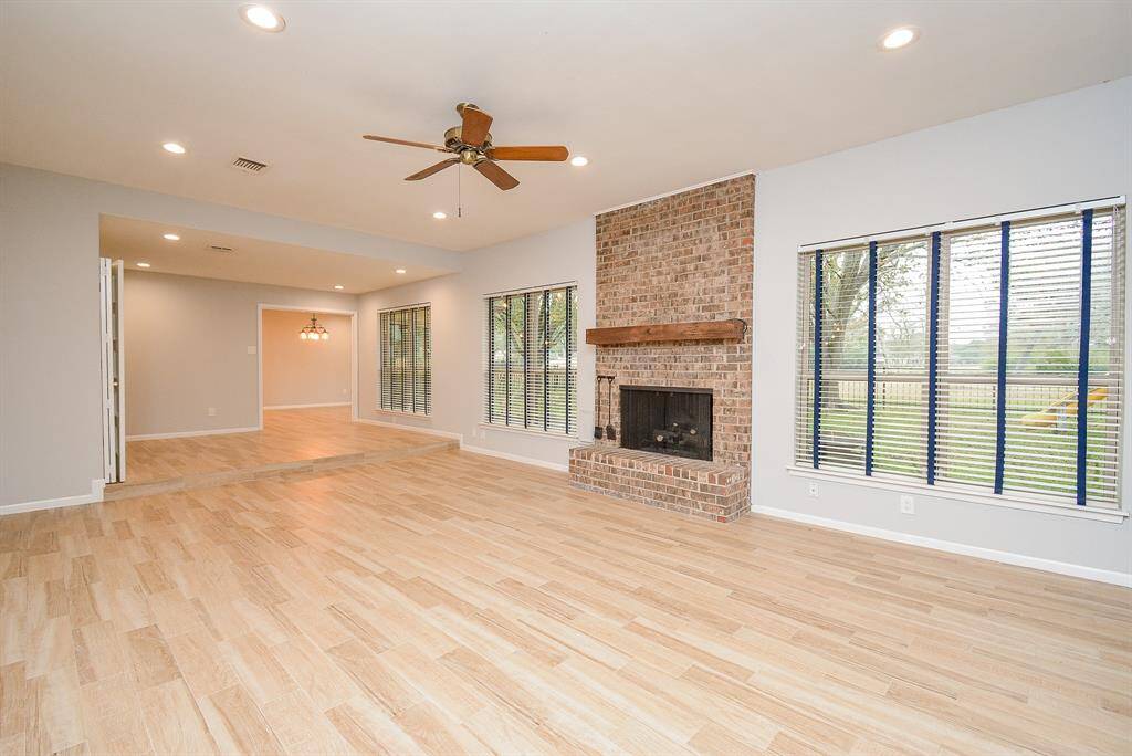 LOOKING INTO THE FAMILY ROOM ONTO THE GOLF COURSE