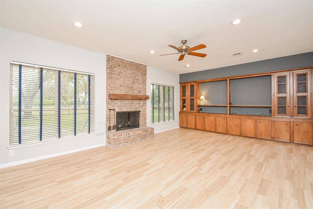 FIREPLACE IN FAMILY ROOM OVERLOOKING THE GOLF COURSE