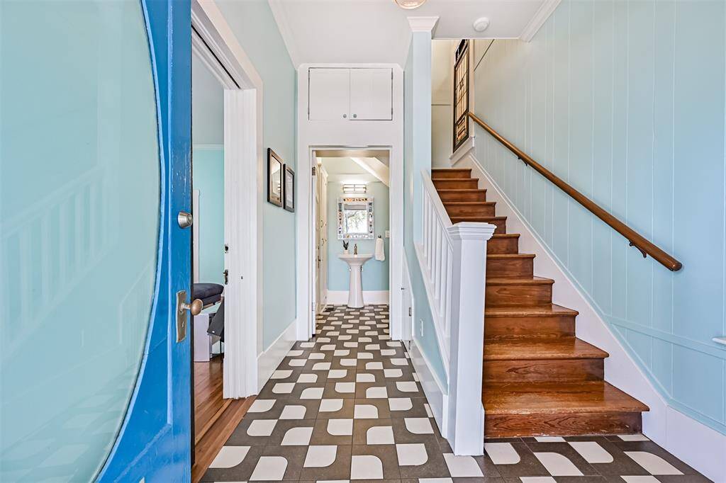 Downstairs half-bath is located under the stairs.