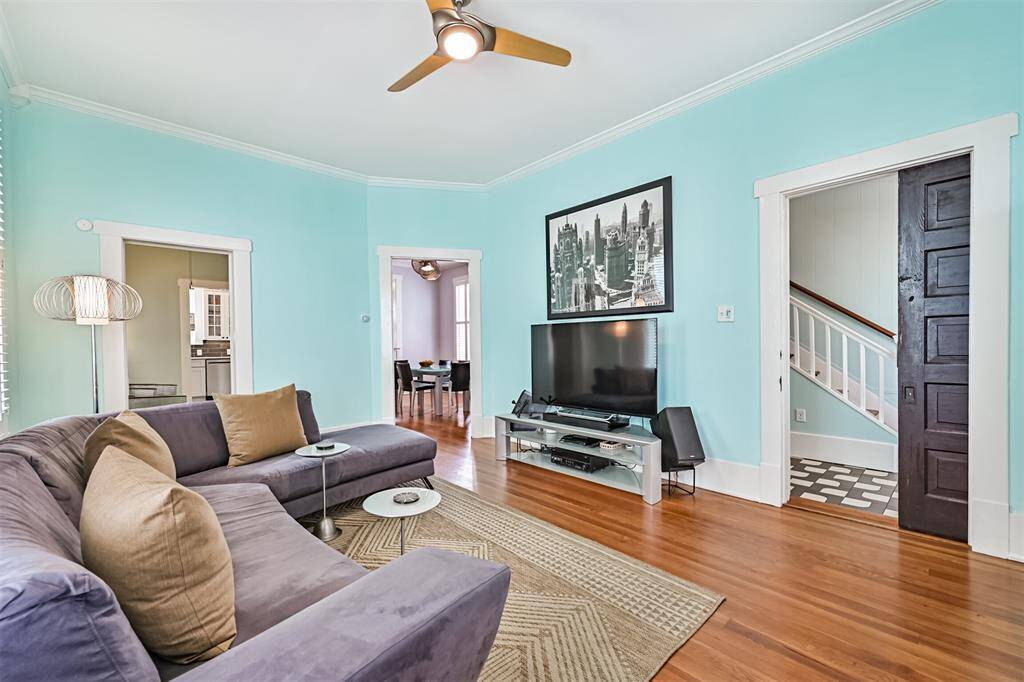 Living room with entrance to the dining room and bonus room.