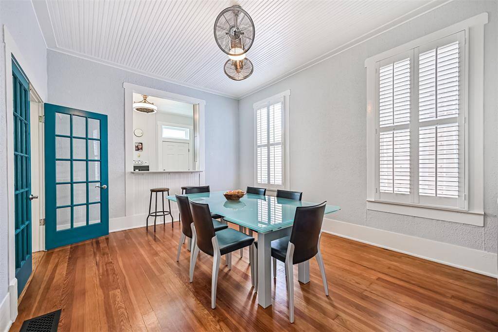 The Dining Room features a pass through opening to the kitchen with bar seating.