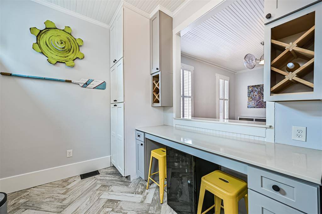 Kitchen is fully outfitted with cabinets to maximize storage space.