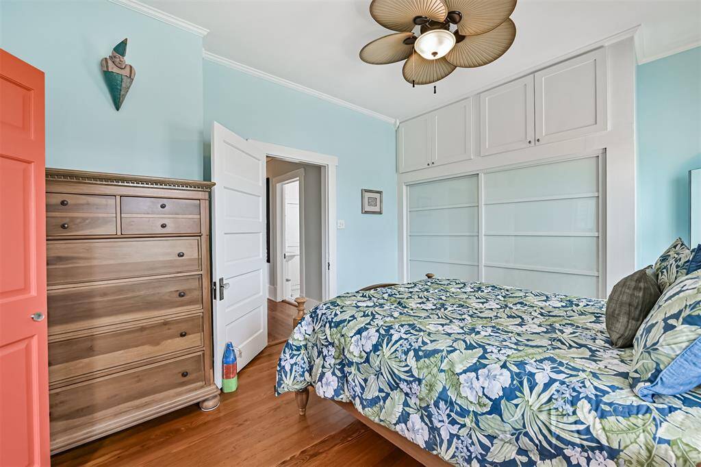 Bedroom features a custom closet with well thought out storage organization.